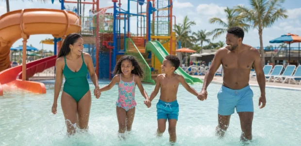 Family enjoying a water park while using family ticket discounts